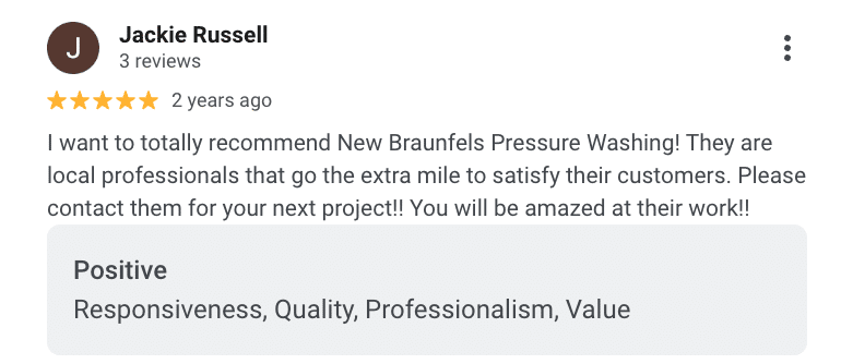 Expert pressure washing service in New Braunfels, showcasing residential roof and gutter cleaning, alongside glowing custo